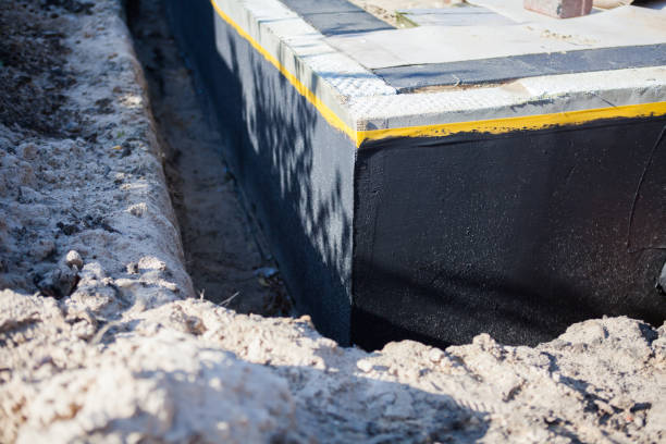 Professional Waterproofing technician working in Albion, IL